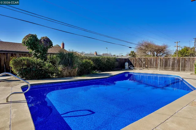 a view of outdoor space and swimming pool