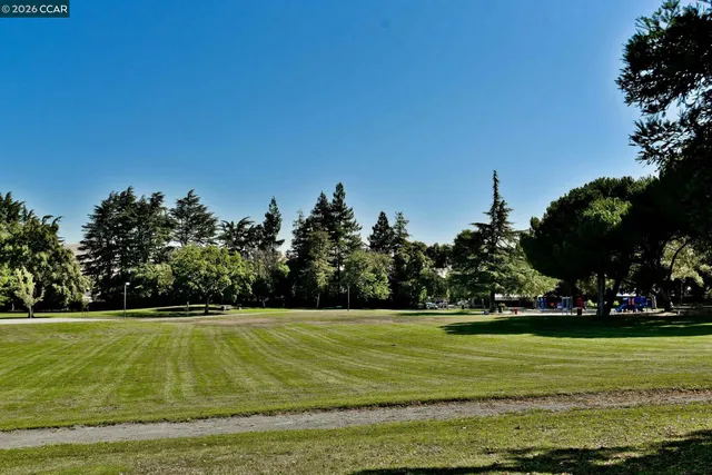 a view of a swimming pool with an outdoor space and seating area
