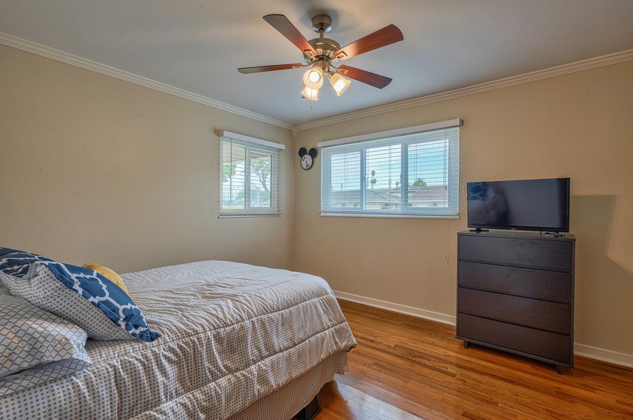 918 Junipero Way Salinas, CA 93901 - Photo 18 of 33 a bedroom with a bed and a window