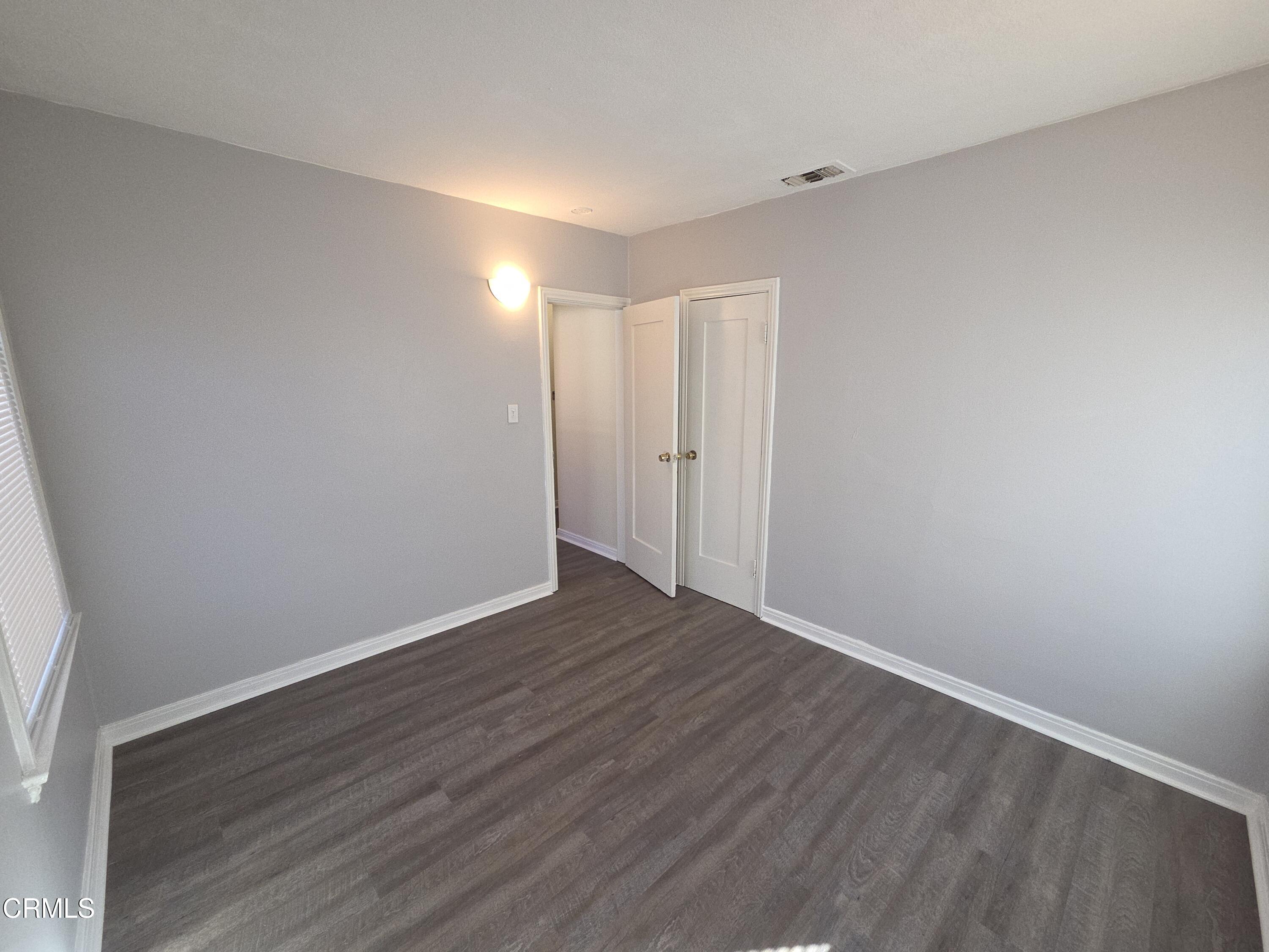 407 South Verdugo Road Glendale, CA 91205 - Photo 11 of 14 a view of an empty room with wooden floor