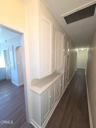 a hallway with wooden floor