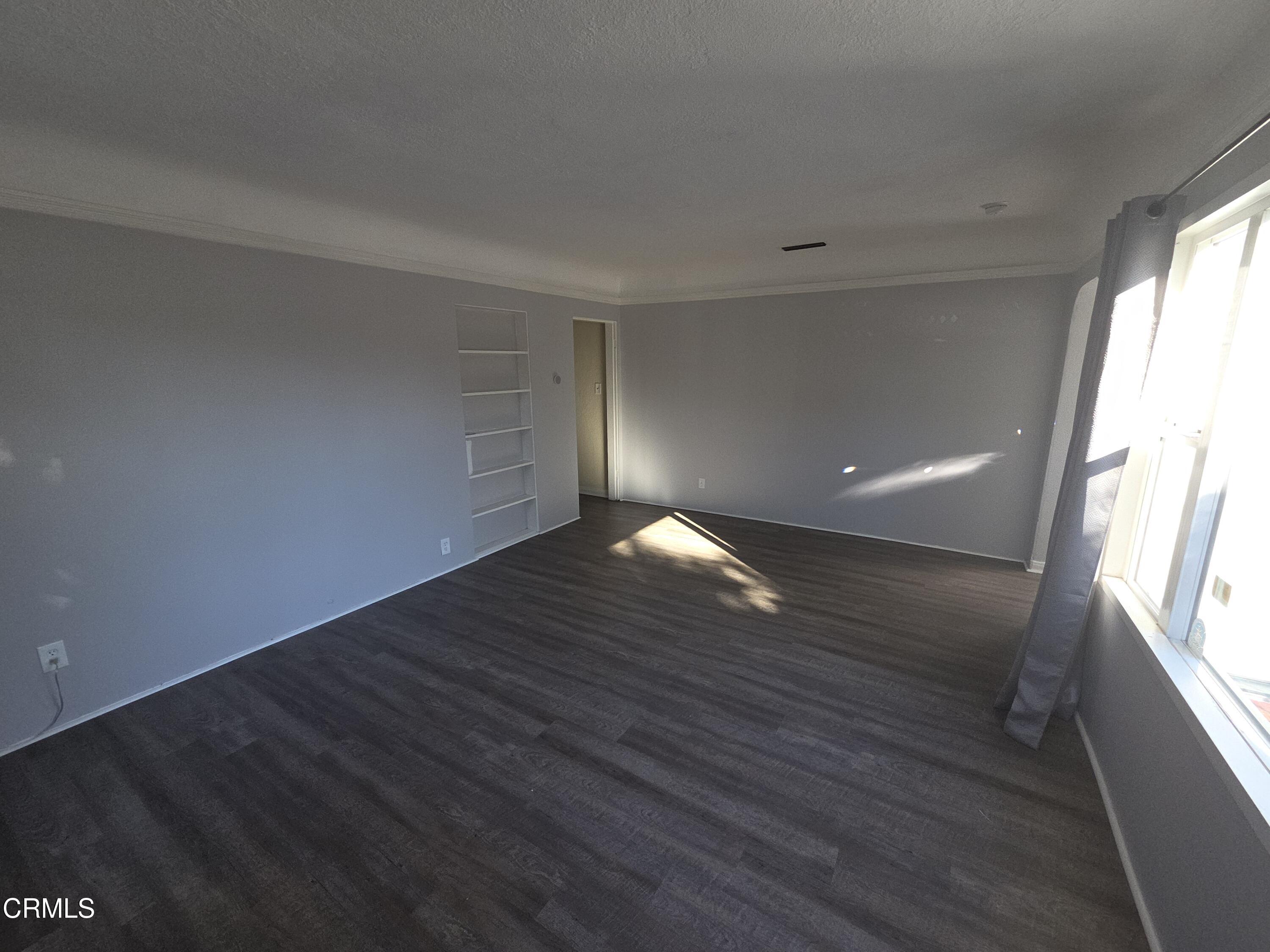 407 South Verdugo Road Glendale, CA 91205 - Photo 3 of 14 a view of wooden floor and windows in a room