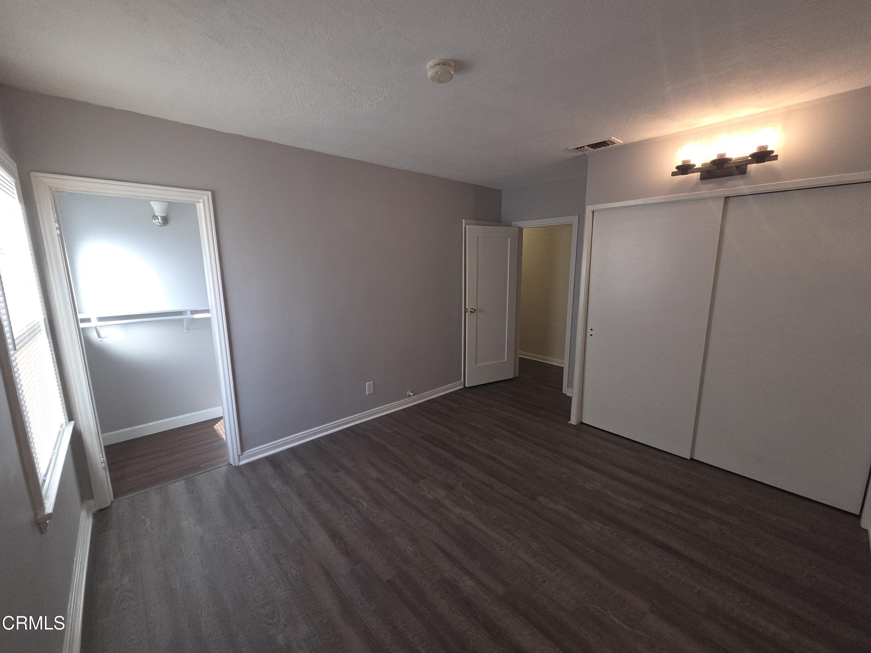 407 South Verdugo Road Glendale, CA 91205 - Photo 9 of 14 a view of an empty room with wooden floor and a window