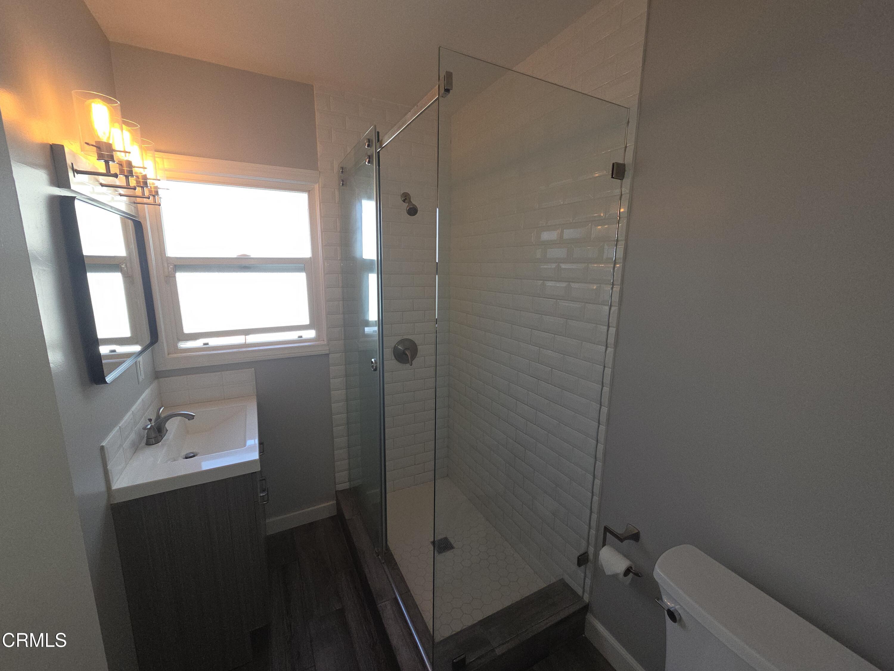 407 South Verdugo Road Glendale, CA 91205 - Photo 10 of 14 a bathroom with a shower a sink and a toilet