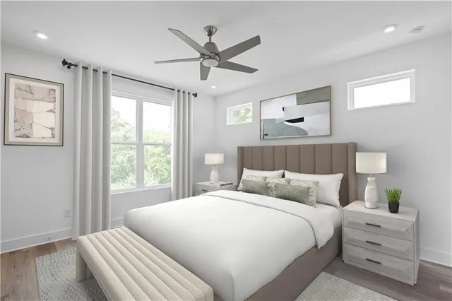 a bedroom with a large bed and a window