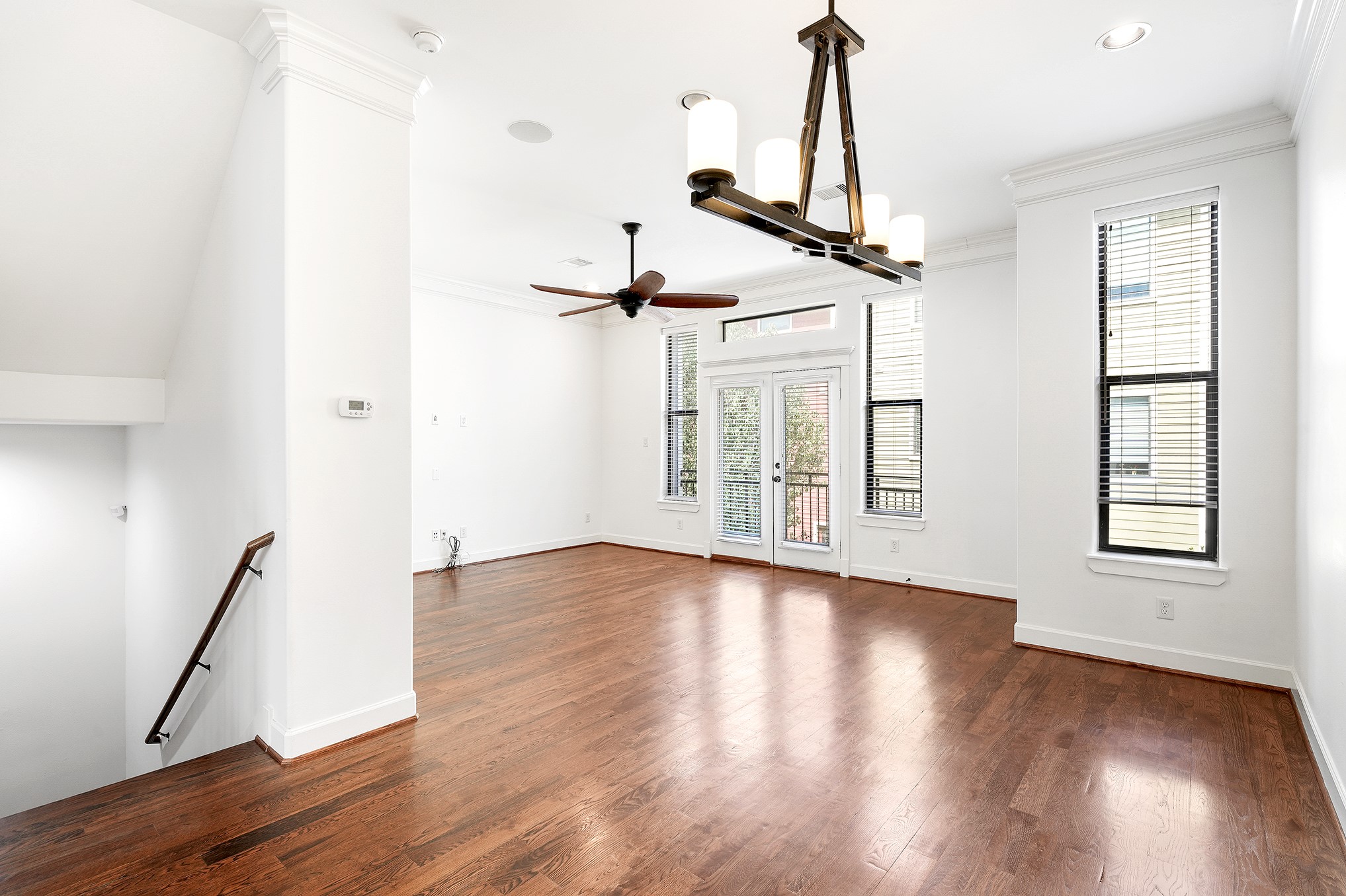 612 West 27th Street Houston, TX 77008 - Photo 11 of 36 a view of empty room with wooden floor and fan