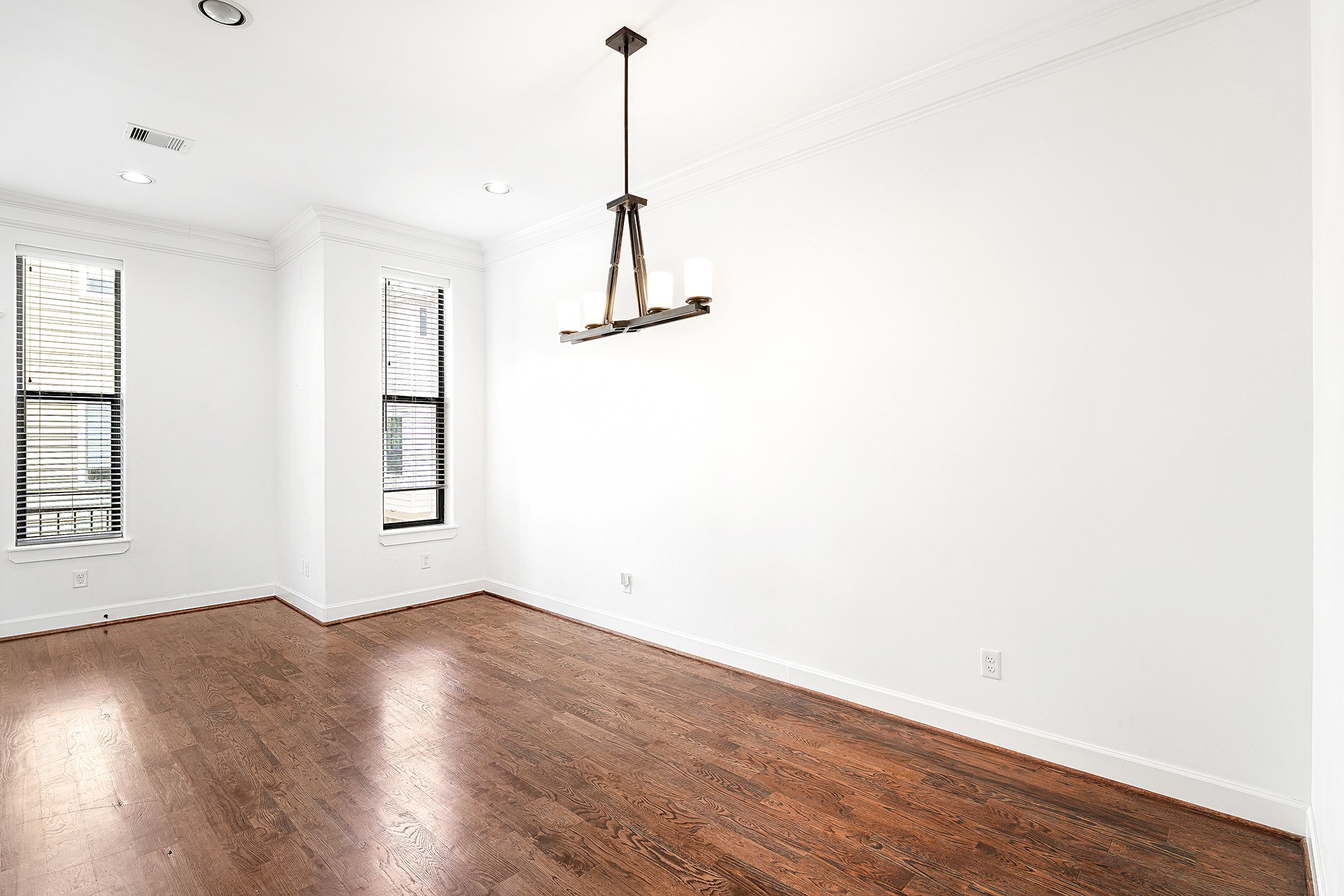612 West 27th Street Houston, TX 77008 - Photo 14 of 36 a view of a room with wooden floor and window