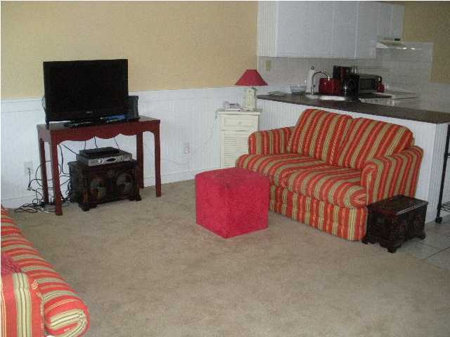 3605 Co Rd 30 - A E, Unit 114 Santa Rosa Beach, FL 32459 - Photo 8 of 14 a living room with furniture and a flat screen tv