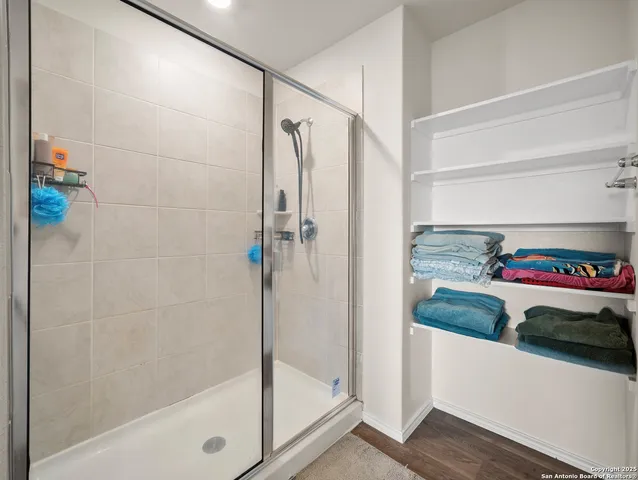 a bathroom with a tub and a shower