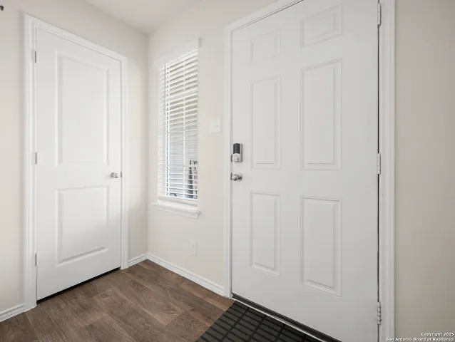 an empty room with wooden floor