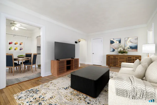 a living room with furniture and a flat screen tv