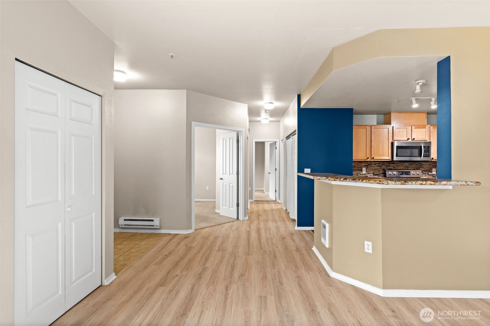 6137 Hazel Loop Southeast, Unit A8 Auburn, WA 98092 - Photo 11 of 40 a view of a kitchen with wooden floor