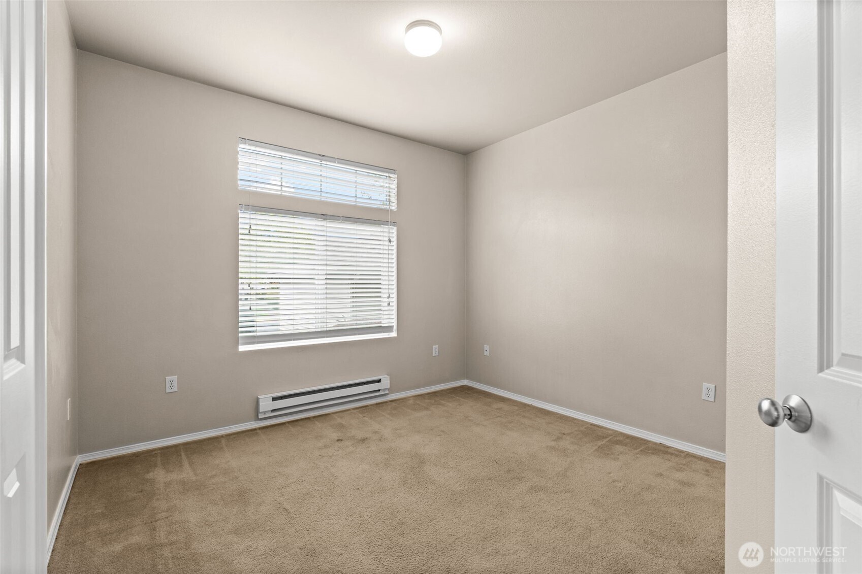 6137 Hazel Loop Southeast, Unit A8 Auburn, WA 98092 - Photo 17 of 40 an empty room with a window
