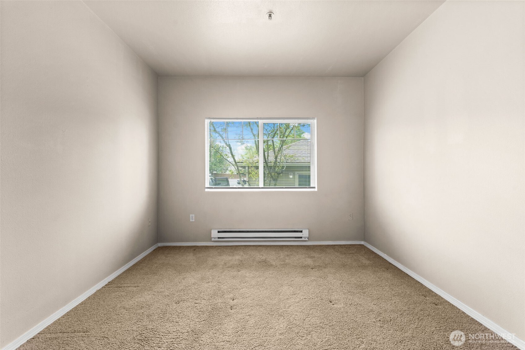 6137 Hazel Loop Southeast, Unit A8 Auburn, WA 98092 - Photo 21 of 40 an empty room with a window