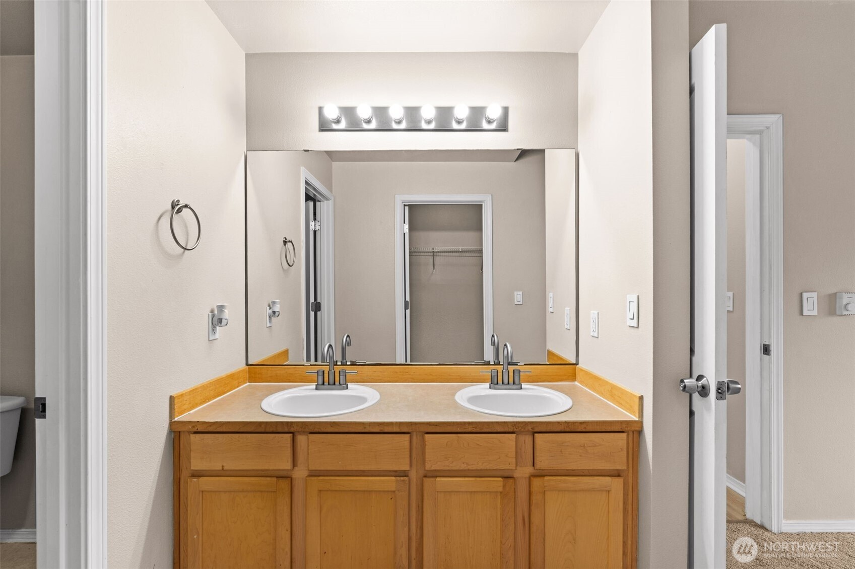 6137 Hazel Loop Southeast, Unit A8 Auburn, WA 98092 - Photo 24 of 40 a bathroom with a sink and a mirror