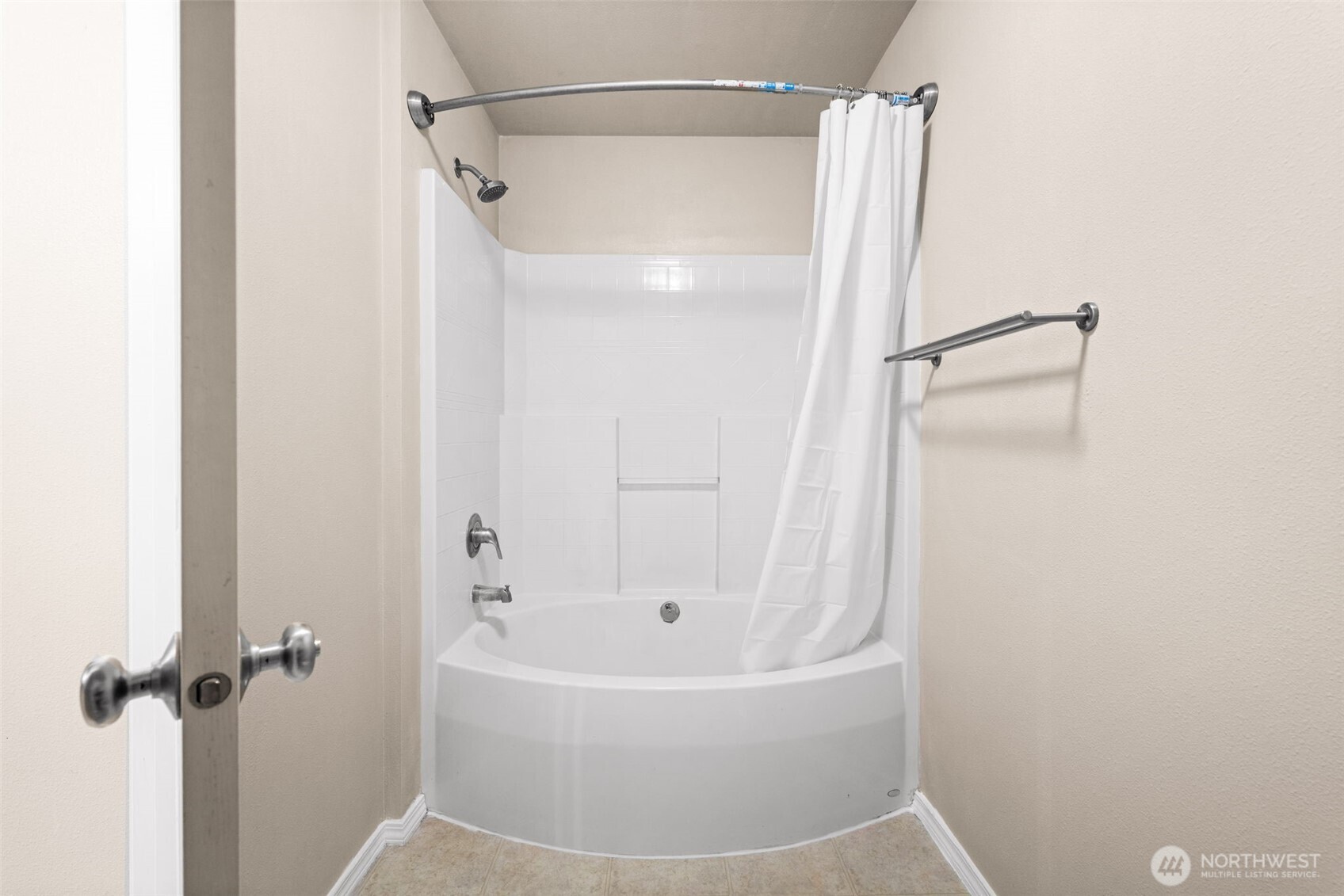6137 Hazel Loop Southeast, Unit A8 Auburn, WA 98092 - Photo 25 of 40 a white bath tub with a shower