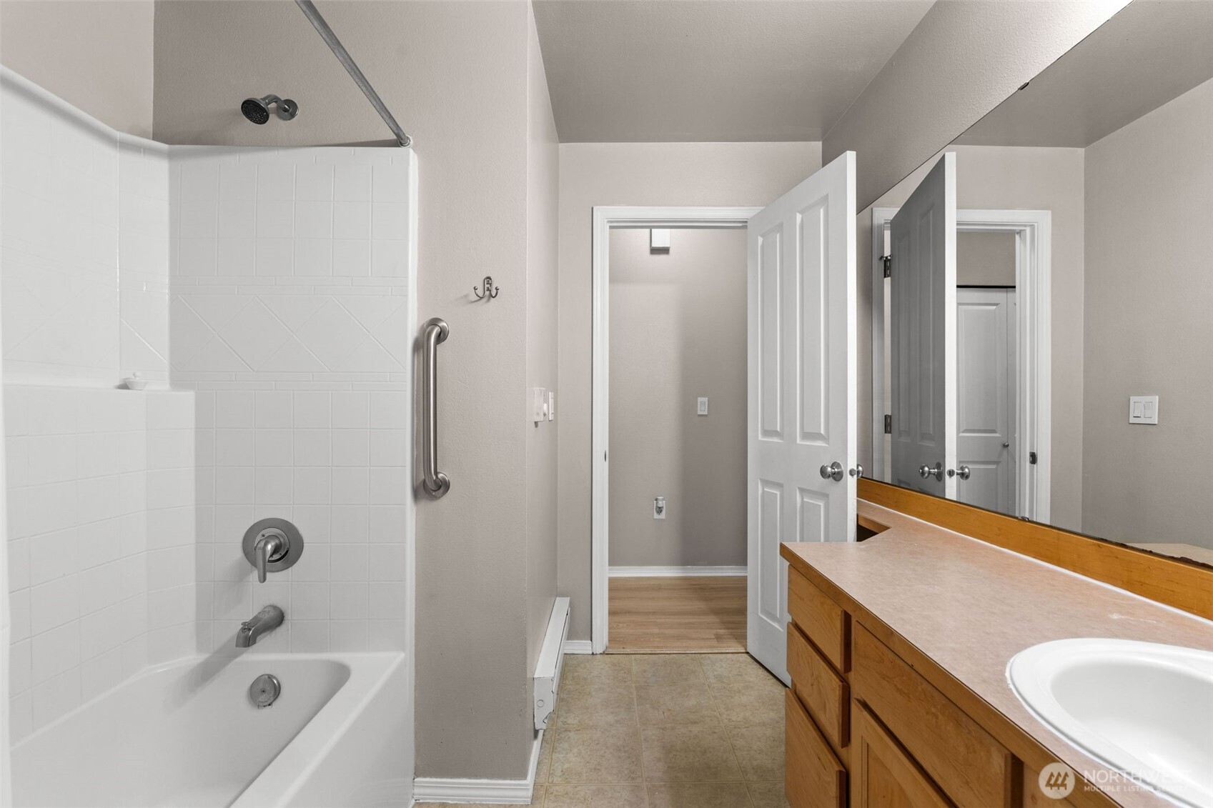 6137 Hazel Loop Southeast, Unit A8 Auburn, WA 98092 - Photo 27 of 40 a bathroom with a granite countertop sink a toilet and shower