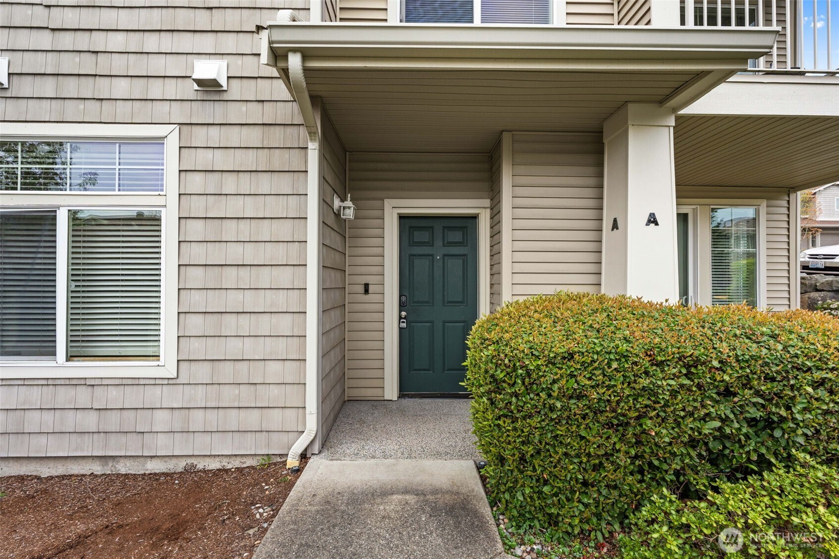 6137 Hazel Loop Southeast, Unit A8 Auburn, WA 98092 - Photo 29 of 40 a view of a entryway door front of house