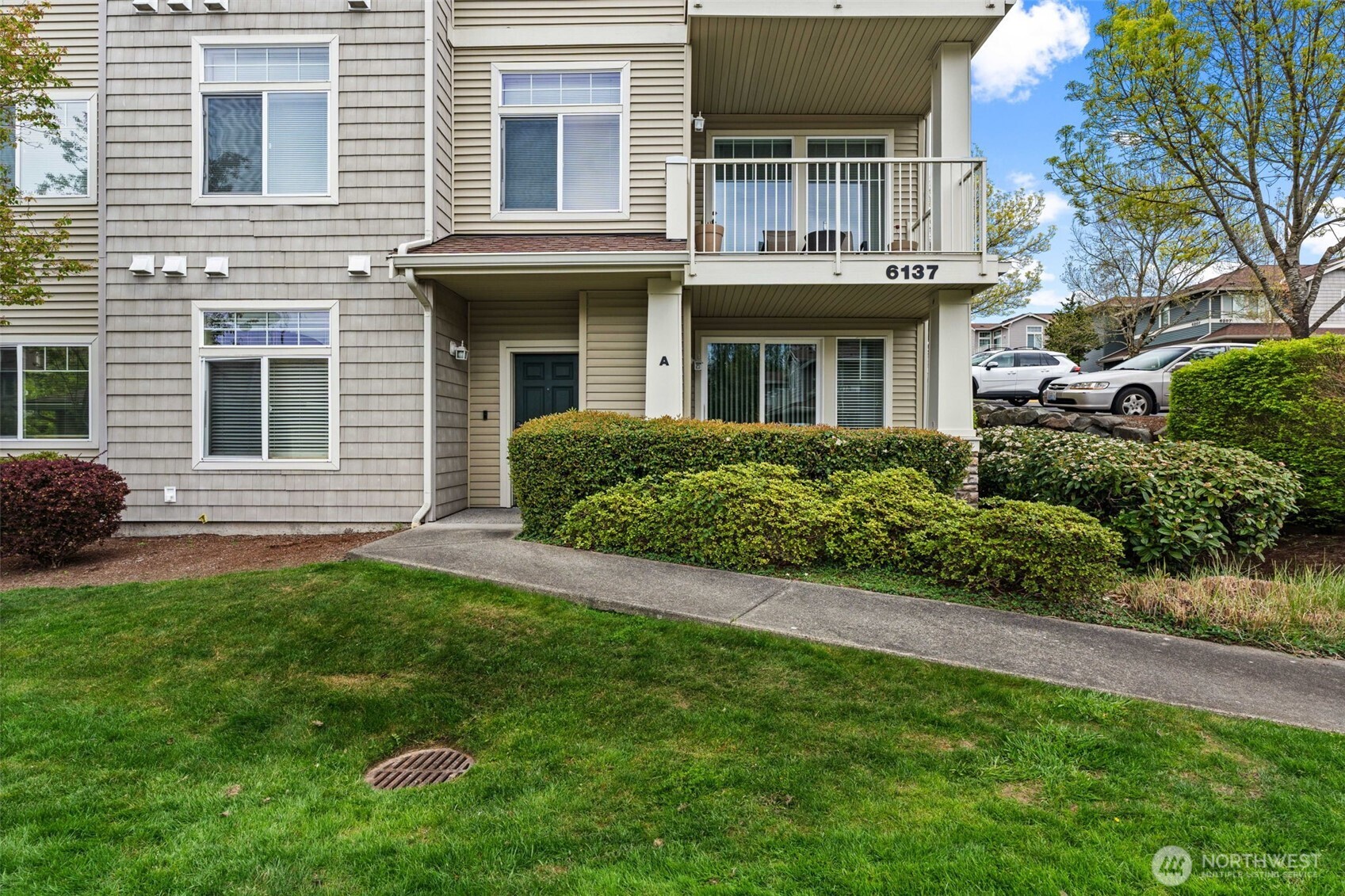 6137 Hazel Loop Southeast, Unit A8 Auburn, WA 98092 - Photo 32 of 40 a front view of a house with a garden