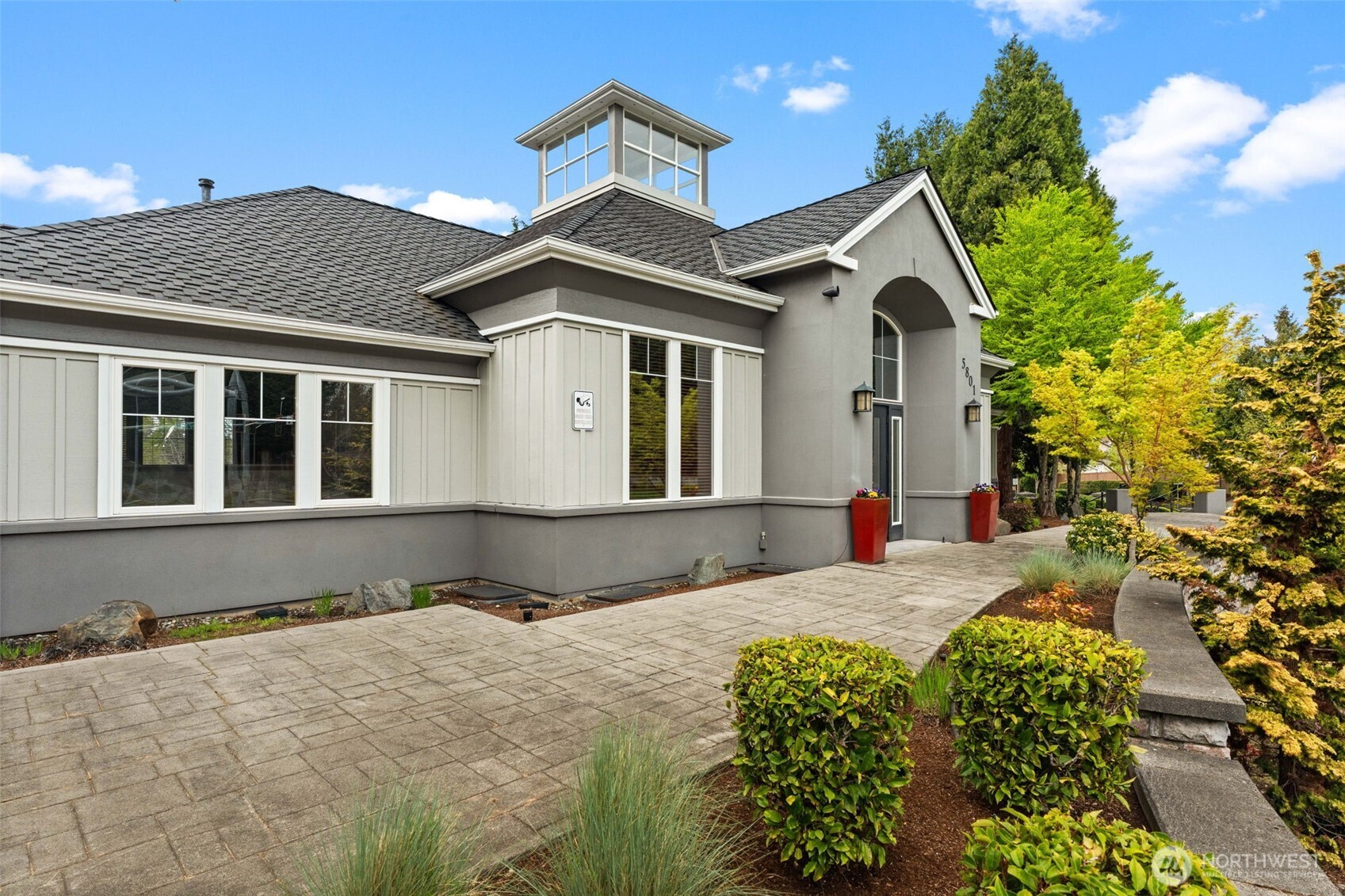 6137 Hazel Loop Southeast, Unit A8 Auburn, WA 98092 - Photo 38 of 40 a front view of a house with a yard