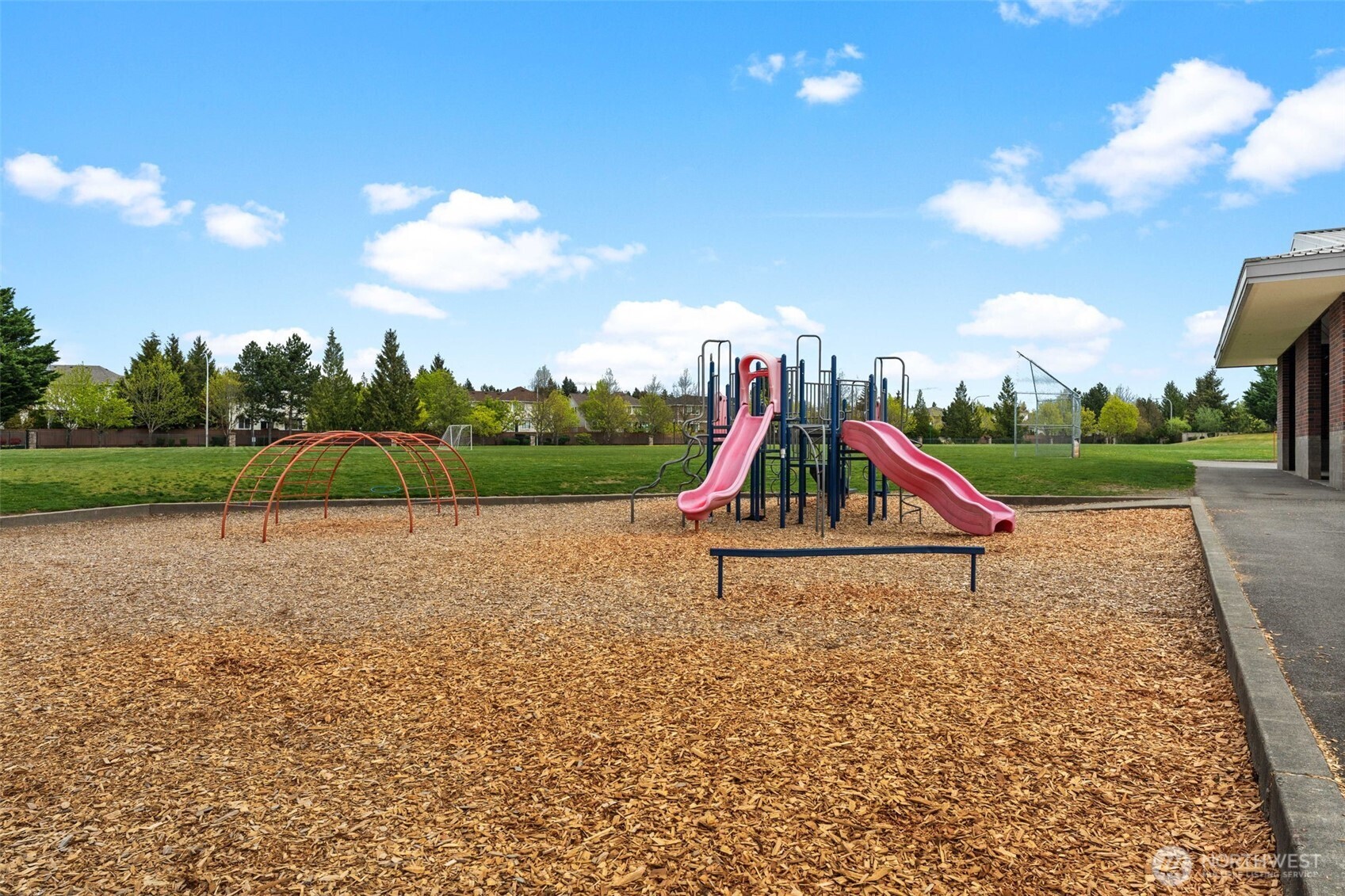 6137 Hazel Loop Southeast, Unit A8 Auburn, WA 98092 - Photo 39 of 40 a view of outdoor space with playground and green space