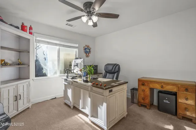 a spacious bedroom with a bed and a table in it