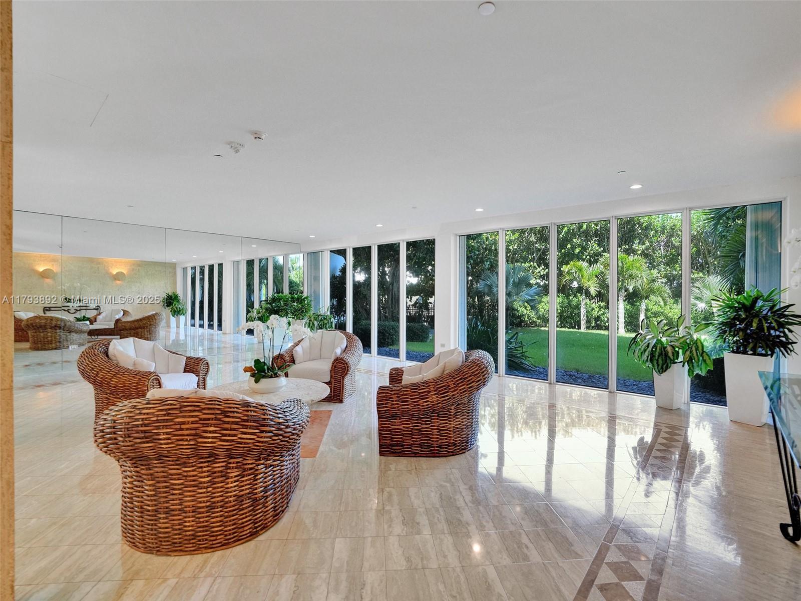 200 Ocean Ln Drive, Unit 803 Key Biscayne, FL 33149 - Photo 18 of 21 a living room with furniture and a large window
