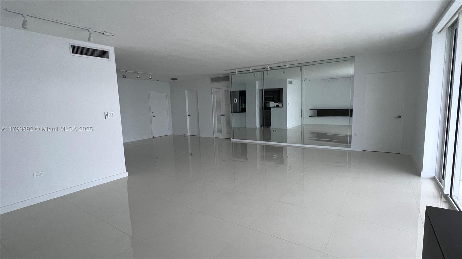 200 Ocean Ln Drive, Unit 803 Key Biscayne, FL 33149 - Photo 19 of 21 an empty room with closet