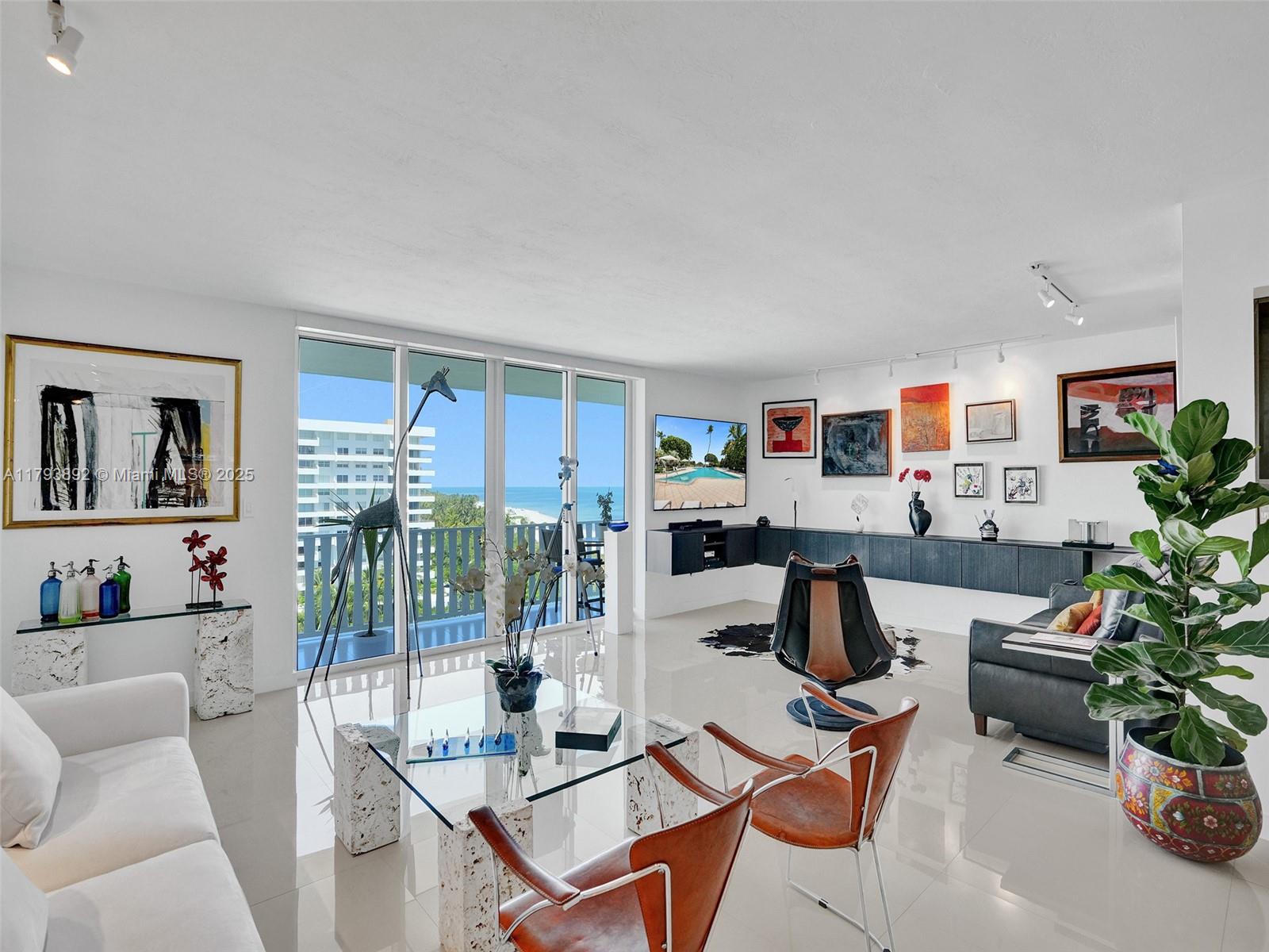 200 Ocean Ln Drive, Unit 803 Key Biscayne, FL 33149 - Photo 4 of 21 a work room with furniture and a potted plant