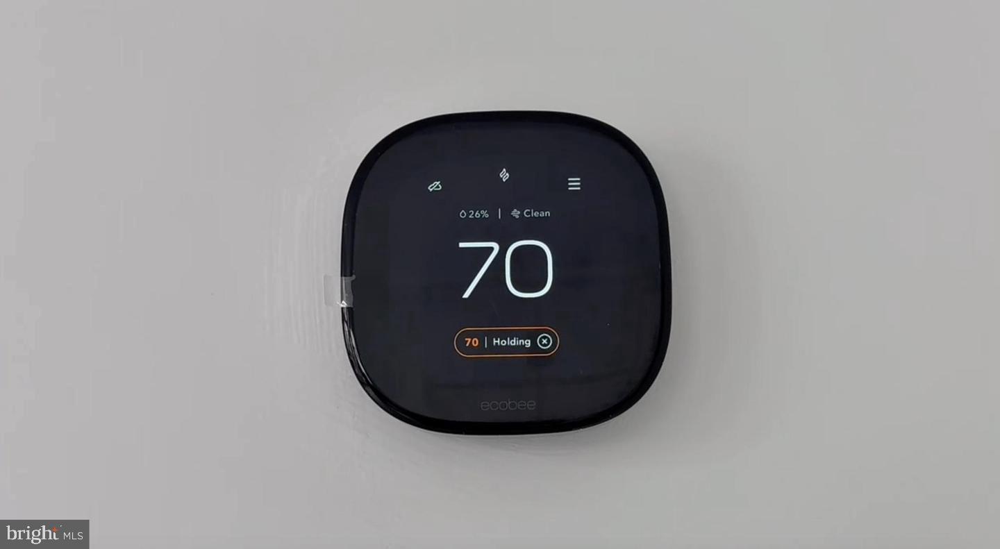 2106 Tysons Ridgeline Road Falls Church, VA 22043 - Photo 28 of 40 Smart thermostat displaying 70degF.