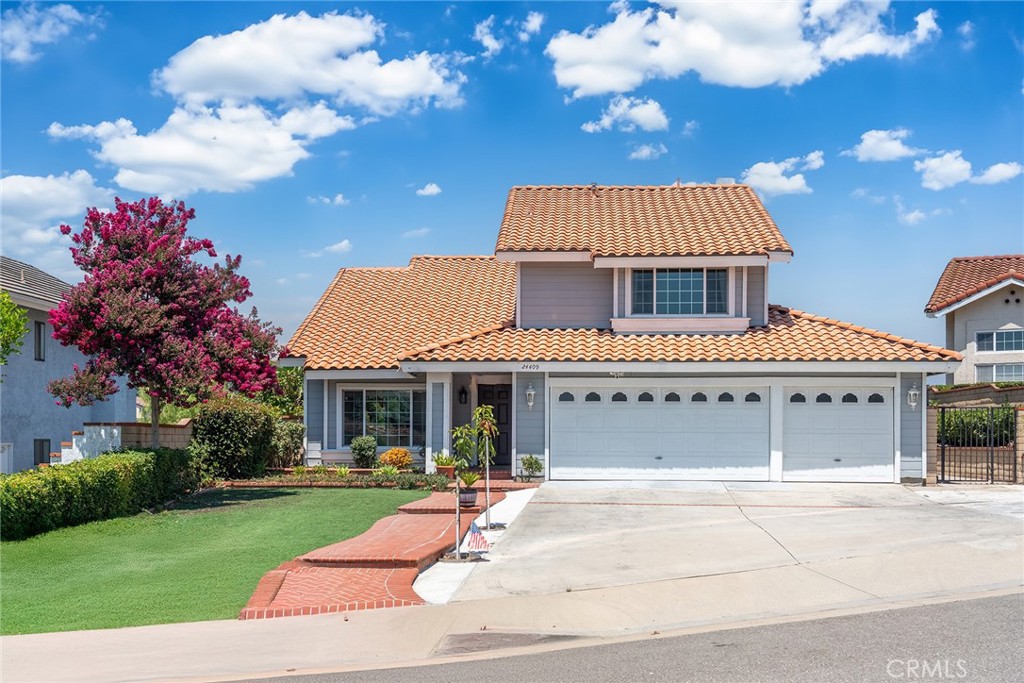 24409 Penrose Court Diamond Bar, CA 91765 - Photo 1 of 1 a front view of a house with garden