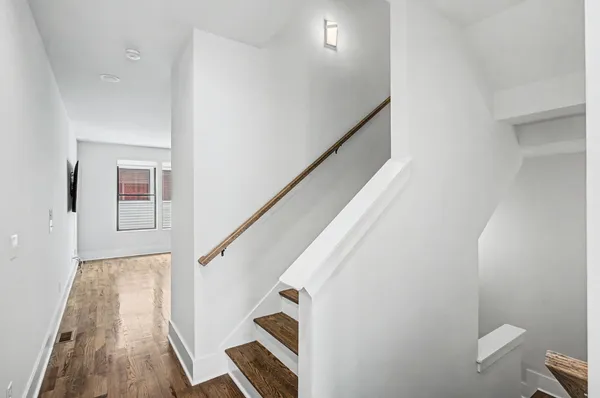 a view of entryway with wooden floor