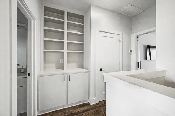 a room with a closet and mirror