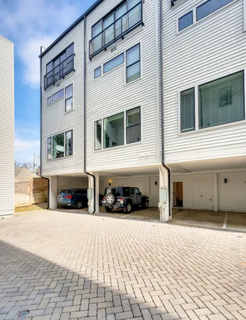 a view of a building with car parked
