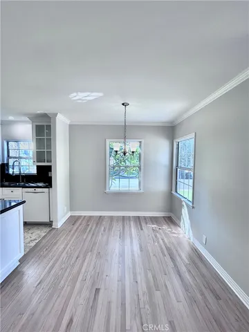 a room with a stove and a refrigerator