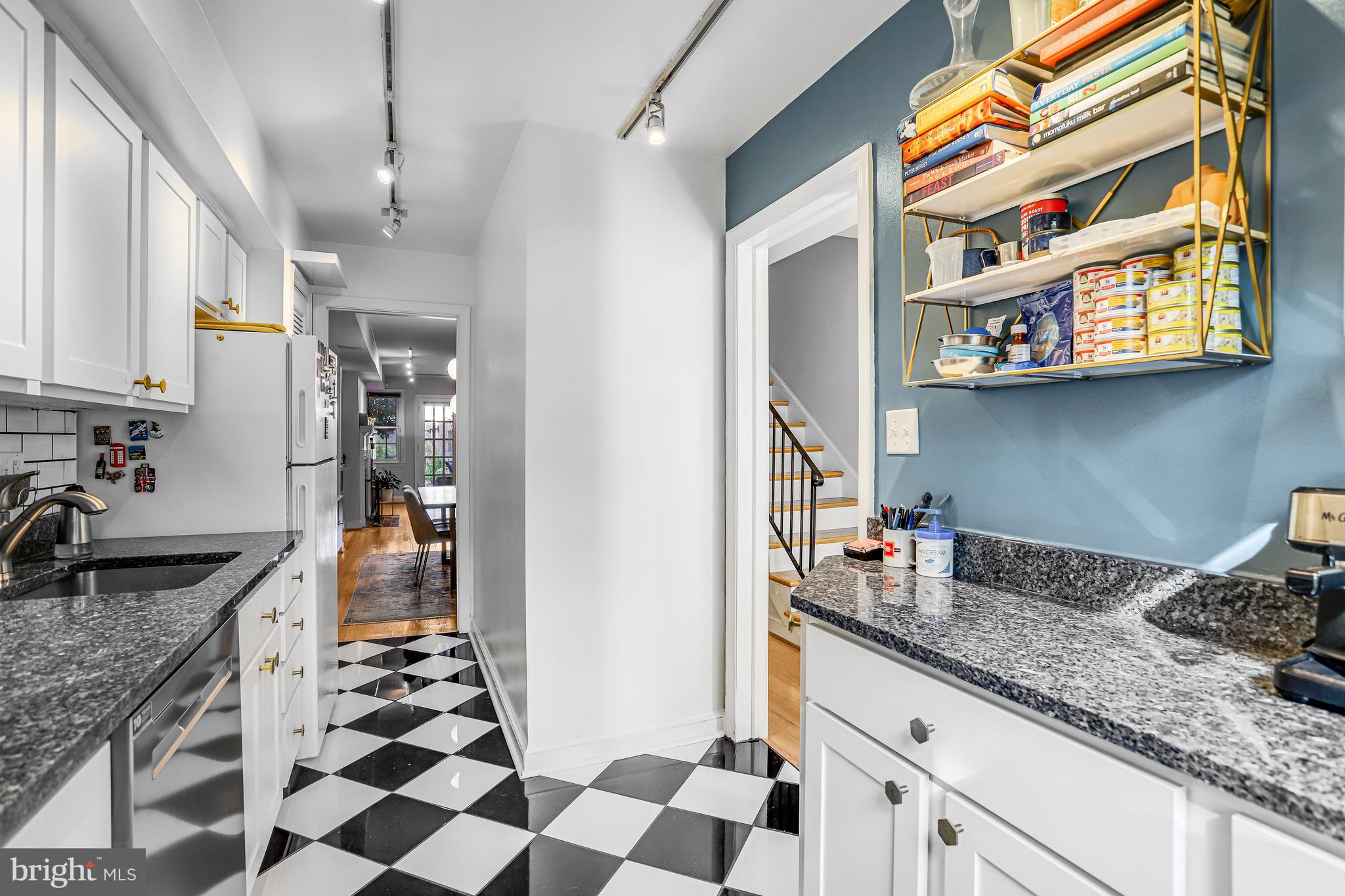 213 9th Street Southeast Washington, DC 20003 - Photo 15 of 74 a kitchen with stainless steel appliances granite countertop a sink stove and cabinets