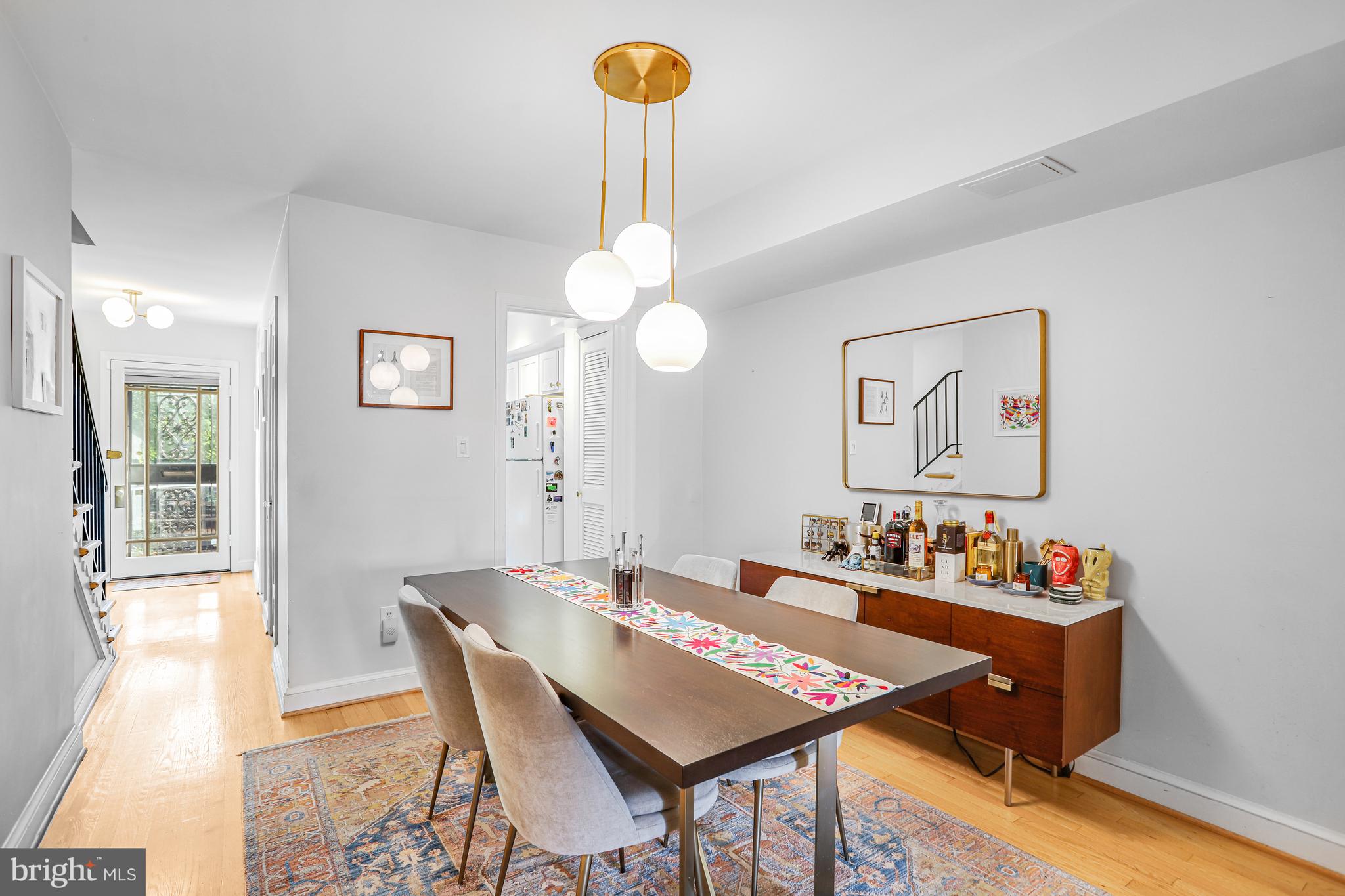 213 9th Street Southeast Washington, DC 20003 - Photo 19 of 74 a view of a dining room with furniture and chandelier