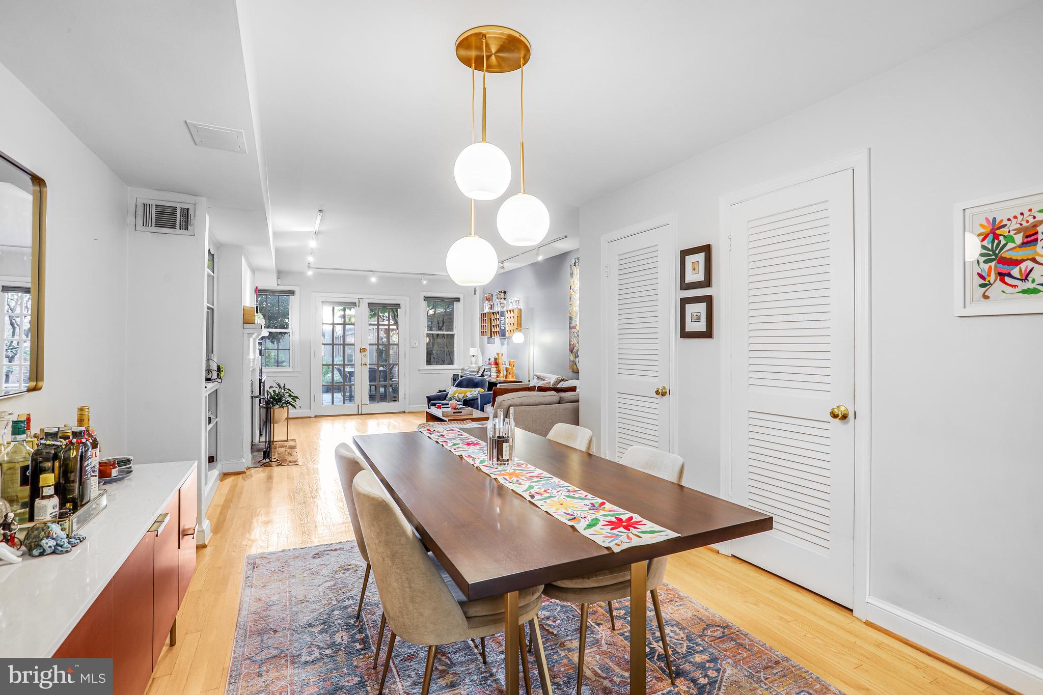 213 9th Street Southeast Washington, DC 20003 - Photo 22 of 74 a living room with dining table and a couch