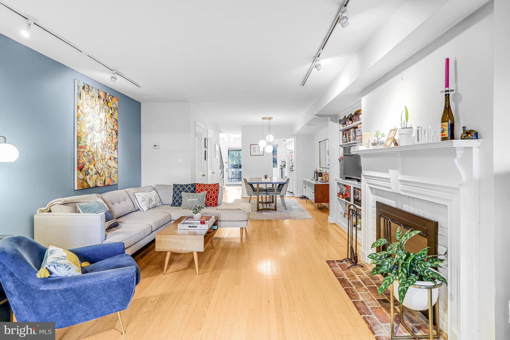 213 9th Street Southeast Washington, DC 20003 - Photo 26 of 74 a living room with furniture and a fireplace