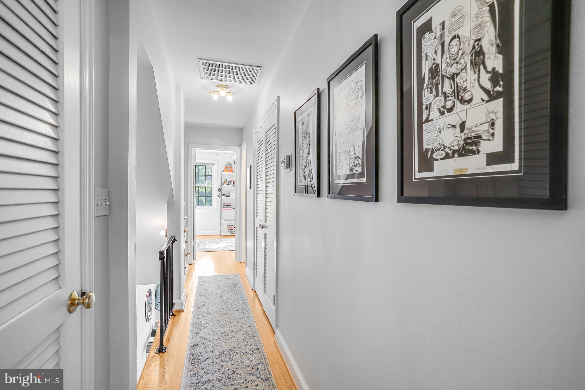 213 9th Street Southeast Washington, DC 20003 - Photo 40 of 74 a view of a hallway with wooden floor and closet