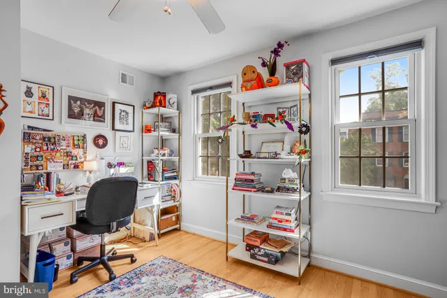 a car parked in front of a brick house