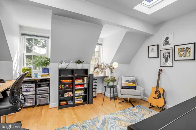 a backyard of a house with barbeque oven table and chairs