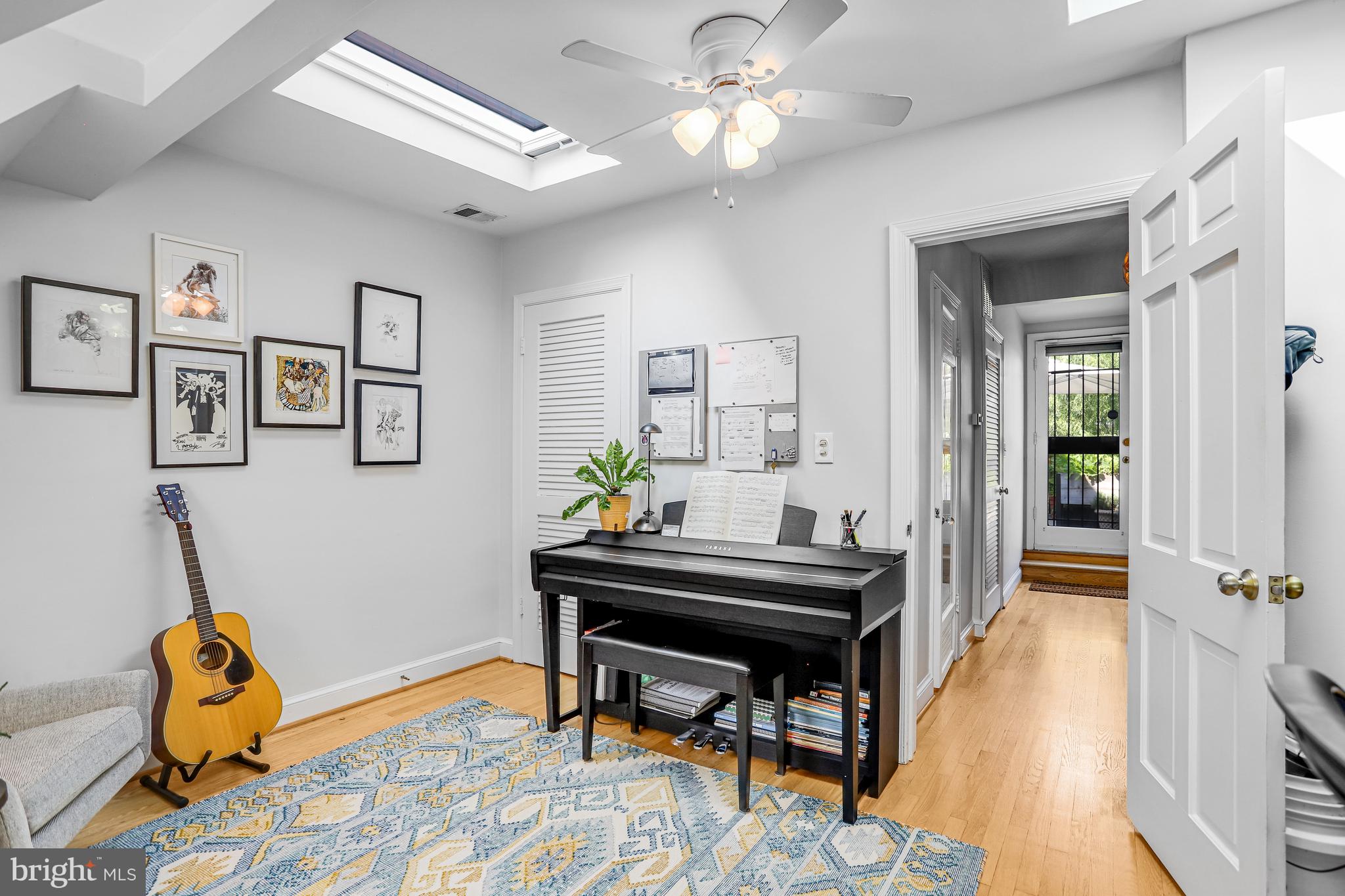 213 9th Street Southeast Washington, DC 20003 - Photo 49 of 74 a view of a workspace with furniture and a front door