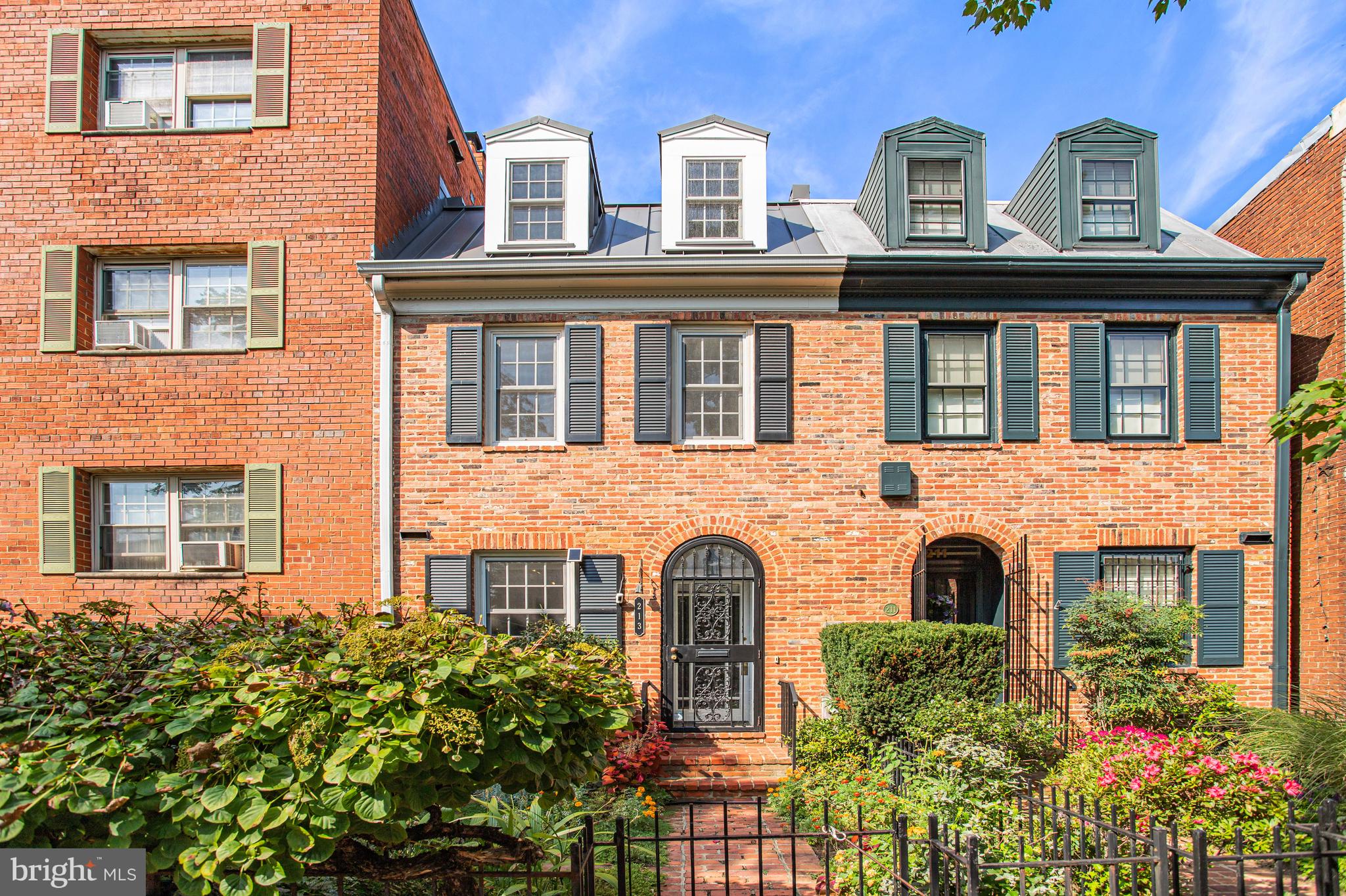 213 9th Street Southeast Washington, DC 20003 - Photo 5 of 74 front view of a brick house with a windows