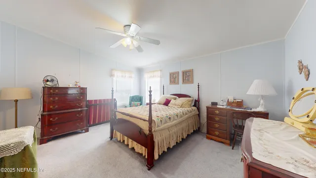 a bedroom with a bed and dresser