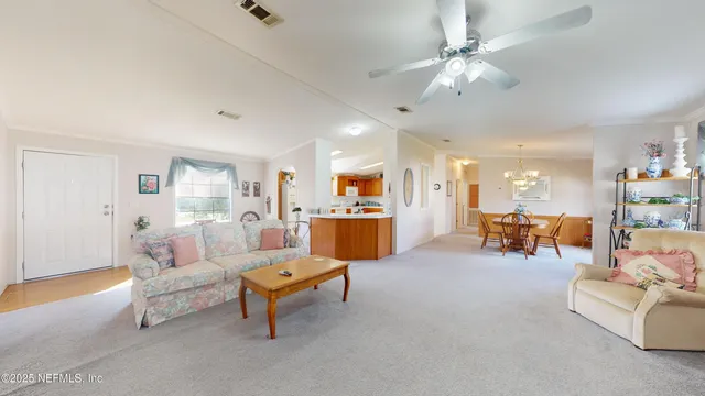 a living room with furniture and a table