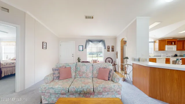 a living room with furniture and a table