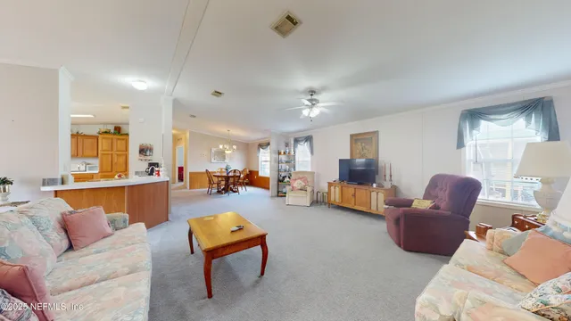 a living room with furniture and a table