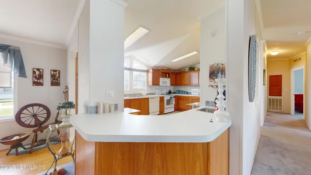 a large kitchen with a table and chairs