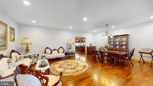 a bathroom with a granite countertop shower a mirror and a sink